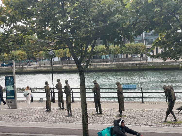 Five statues (of people) represent those who perished on Coffin Ships trying to reach Canada & USA during the Potato Famine in 1845.